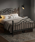 Queen Metal Bed Frame With Classical Headboard And Footboard Matte Black Steel Platform Bed Featuring Ornate Ball Details in a cozy bedroom.