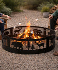 36 Inch Heavy Duty Wood Burning Fire Pit Ring With Decorative Wildlife Design in use with people roasting marshmallows