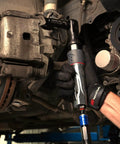 Mechanic using 1077XPA Half Inch Air Ratchet Wrench With 360 Degree Exhaust Adjustable Power Regulator 54 Foot Pound Torque 160 RPM Beefy Build For Automotive And Maintenance on vehicle brake system