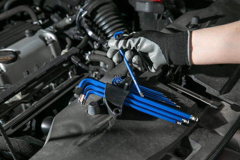 Mechanic using Metric Long Arm Ball End Hex Key Set With Chrome Finish And Bright Blue Anti-Slip Coating Includes 9 Sizes From 1.5mm To 10mm
