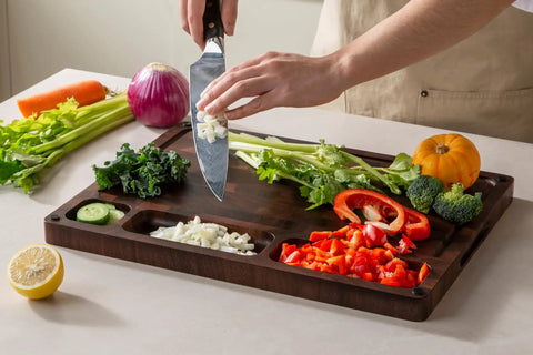 Top Shelf Solid Walnut End Grain Cutting Board Heavy Duty Kitchen Prep Surface With Deep Juice Channels 17X13X1 Inch, with chopped vegetables.