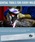 Welder using welding torch on metal pipe with Two Piece 5 Inch Set Up Wedge For Planers Shapers Milling Machines And Other Similar Applications Used To Position Or Add Space Between Parts And Materials In Setup For Precise Alignment Support And Easy Machine Setup displayed.