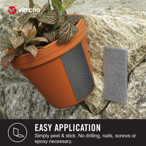 Industrial Strength Hook And Loop Fasteners For Extreme Outdoor Weather, Heavy Duty Holds Up To 15 Lbs, 4 X 2 Inch Strips, 3 Sets, Titanium, UV Resistant For Indoor Or Outdoor Use, shown attached to a flower pot on stone surface.