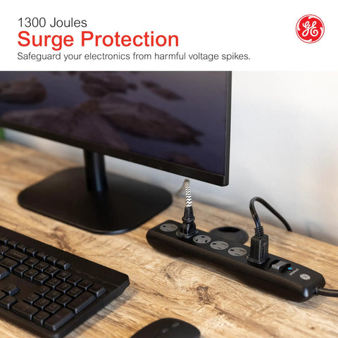 Surge Protector Power Strip With Six Outlets Eight Foot Extension Cord 1300 Joules Of Surge Protection Flat Plug shown on desk