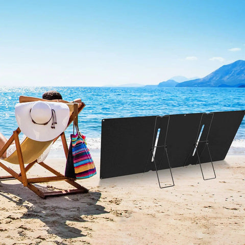 Beach scene with 2 Pack Portable Folding Solar Panel Stand With Quick Angle Adjustment Lightweight Mount for camping or emergencies.