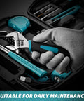 Person holding an adjustable wrench from the 124 Pcs 4V Cordless Screwdriver Tool Kit Set With 6 Plus 1 Torque Settings Adjustable 3 Position 4Nm Electric Screwdriver Flexible Shaft Storage Toolbox For Home Projects