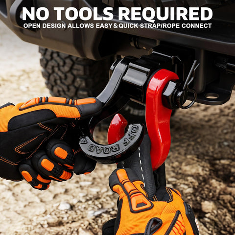 Hands demonstrating use of Tigertooth Three Quarter Inch D Ring Shackles With Seven Eighths Inch Pin For Tow Straps And Winch Recovery Off Road Vehicles Beefy Heavy Duty 45000 Lb Break Strength Bright Red in action