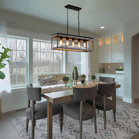 Industrial Farmhouse 5-Light Kitchen Island Pendant In Wood And Metal Dope Linear Chandelier With Antique Gold And Black Finish Ideal For Dining Room Or Kitchen Sloped Ceiling Compatible Easy Install And Adjustable Chain hanging over dining table in modern kitchen setting.