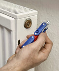 Double Joint Folding Cabinet Key With Magnetic Locking Three Profiles Outside Square Triangle And Double Bit in use on radiator