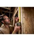 Person using Fatmax Autolock Tape Measure 8m Metric Only Yellow Black, Reverse Lock For One-Handed Control on wooden structure