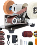 Mini belt sander kit with brown sanding belts and a white polishing wheel; compact electric knife sharpening grinder.
