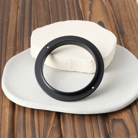Male To Male M54x0.75 Telescope Adapter Ring For 50Mm Lens Filter shown on wooden surface with 54x0.75 threads visible