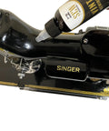 Premium Sewing Machine Restoration Polish And Cleaning Kit With Wax Microfiber Cloth Foam Pad Oil And Grease For A High Gloss Finish Plus Pro Grade Precise Lubrication Bottle With Taper Spout And Long Spout Syringe Design on black Singer sewing machine