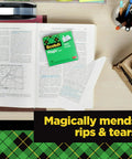 Open book on desk with Invisible Magic Tape 4-Pack Refill Rolls 0.75 in x 1000 in, Matte Finish, showing repaired pages.