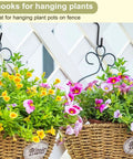 Hanging plants using Heavy Duty S Hooks For Wire Shelves 30 Pack Black Hanging Hooks For Kitchenware Pots Pans Utensils Towels Bags Jeans Plants Storage Rack Organization Solutions on a fence.