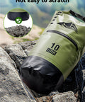 Lightweight Waterproof Dry Bag With Front Zip Pocket 10L Roll Top Closure Keeps Your Gear Dry For Travel Kayaking Boating Rafting Camping Hiking And Beach Days Green on rocky surface