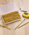 50 Pc Deck Screws Set, 5 Inch #10 Self Drilling Wood Screws With Rust Resistant Coating in plastic box on wooden surface.