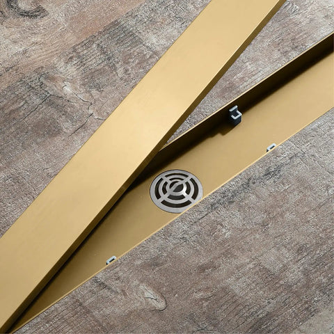 Heavy Duty Linear Shower Drain 23.6 Inch Invisible Floor Trench With Snap Off Hair Catcher Screen 304 Stainless Steel shown on wooden surface.
