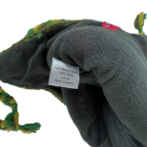 Cozy Winter Wool Knit Beanie With Fleece Lined Earflaps showing inside label with wool and polyester lining details