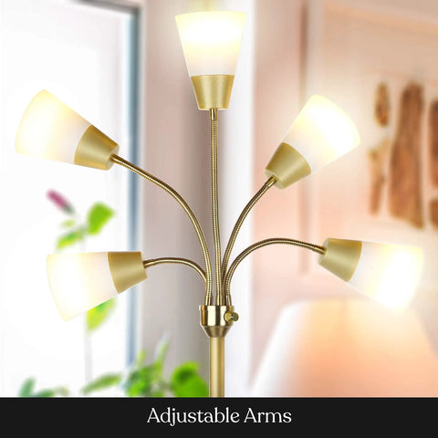 Lit Five Head LED Floor Lamp for Living Rooms and Offices with Interchangeable Shade and Brass Finish illuminated indoors.