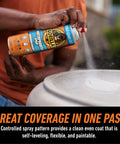 Man using Clear Rubberized Waterproof Sealant Spray 14 Ounce That Seals Out Water Air and Moisture on outdoor surface