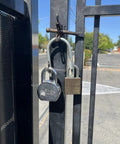 Super Secure Dual Padlock Gate Lock Killing Messy Daisy Chains For Hella Tough Barn Yard Protection Letting Two Different Property Owners Use Their Own Separate Keys on a gated entrance.