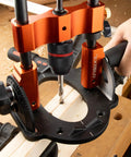 Portable Multi Angle Drill Guide with 60 Degree Adjustable Stand used on wood for precise hole alignment, includes center guide.