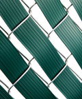 Close-up of Dark Green PVC Fence Slats For Privacy 1.8 Inch By 246 Feet Privacy Fence Plastic Strips with brass fasteners