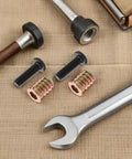 Metal Threaded Inserts Kit For Wood Furniture Assembly With Wrenches And Drill Bit Screw In Fasteners close-up on burlap
