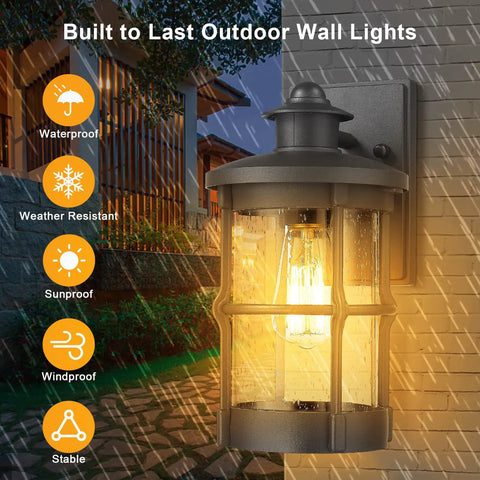 Outdoor Wall Sconce Lighting Fixture Finished In Black With Seeded Glass Set Of 2 For Exterior Walls Perfect For Entryways Porches Patios And More Durable Metal Exterior Lighting 7.5 In Tall 6.5 In Wide 12.2 In High, illuminated at night on a wall