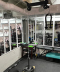 Ceiling Mount Gym Pulley System Stand With Preinstalled Pulleys For DIY Home Gym Or Garage LAT Pulldown And Squat Rack Attachment 16 Inch Hole Spacing installed in gym.