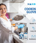 No Sweat Blue Nitrile Gloves Medium 100 Count Built Tough At Three Mil Thick Powder Free Latex Free With Slick Textured Grip Ideal For Kitchen Cooking House Cleaning And Beauty Salons Smooth Reliable Safety For Any Job You Grab, worn by a smiling woman in a kitchen.
