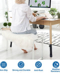 Heavy Duty Four Pack Folding Table Risers And Adjustable Height Leg Extenders For Bent Or Straight Furniture Legs being used on a desk with a person working.
