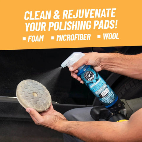 Person spraying Foam And Wool Polishing Pad Cleaner Citrus Based 16 Oz on a wool pad for auto detailing.