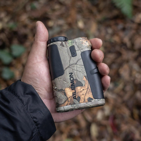 Waterproof Hunting Rangefinder With 5 To 900 Yards Range Fast Under 0.5 Seconds Readouts Camo Laser Distance Finder Angle And Scan Modes 6X Magnification Hunt Ready Archery Tool For Hunters in hand
