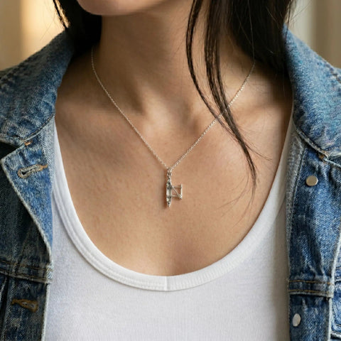 Woman wearing Outrigger Canoe Charm Necklace For Women Sterling Silver Dainty Handmade Ocean Boat Pendant 18 Inch Minimal Layering Jewelry