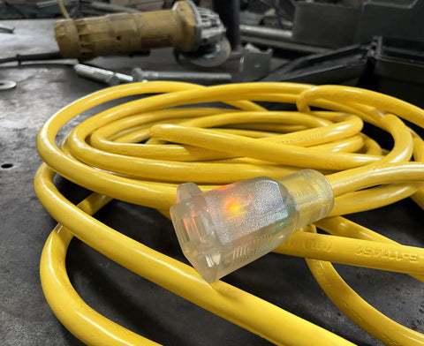 Yellow Heavy Duty Lighted Extension Cord 1 Pack With Double Insulated Plugs SJTW Outer Jacket on workshop table