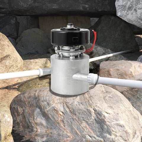 Three-Phase AC Hydro Generator With Three Inlet Portable Water Turbine on a rock in a natural setting.
