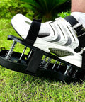 Close-up of foot wearing Lawn Aerator Shoes With No Fuss Self Leveling Spikes And Spring System 3 Inch Ground Stakes for grass
