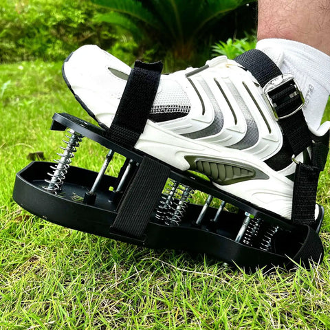 Close-up of foot wearing Lawn Aerator Shoes With No Fuss Self Leveling Spikes And Spring System 3 Inch Ground Stakes for grass