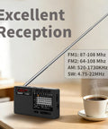 Dope Portable Shortwave Radio With DSP And 12 Bands AM FM SW, 22 inch antenna in a room with coffee cup on table