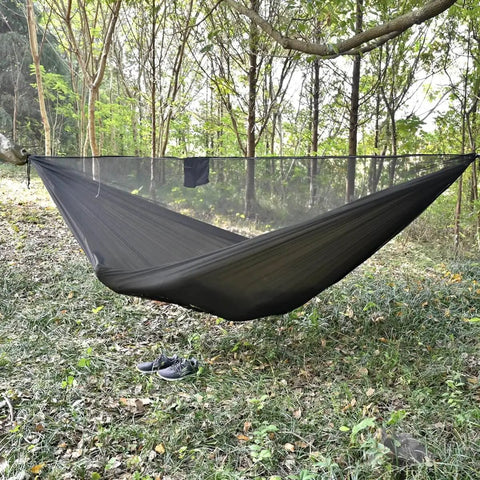 Double Camping Hammock With Mosquito Net Ridgeline And Straps 11Ft Lightweight Nylon Ripstop 500lb Capacity in forest setup