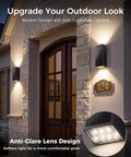 Rugged As Nails 2 Pack Solar Wall Lights Outdoor IP65 Waterproof, modern black up down sconce mounted by front door.