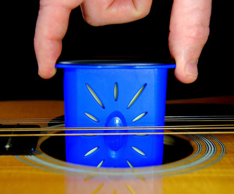 Premium Humidity Care System With Humitar And HumiReader 3 In 1 Digital Hygrometer placed inside a guitar for moisture control.