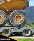 Badass Heavy Duty Lever Load Binder For 516 Inch Grade 70 Chain With 5400 Lbs Working Load Limit And 16200 Lbs Break Strength handling secured cargo on a flatbed trailer.
