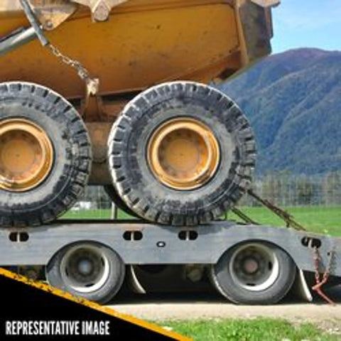Badass Heavy Duty Lever Load Binder For 516 Inch Grade 70 Chain With 5400 Lbs Working Load Limit And 16200 Lbs Break Strength handling secured cargo on a flatbed trailer.