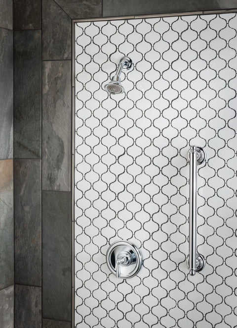 Brantford Oil Rubbed Bronze Posi-Temp Shower Trim Kit With Integrated Shower Head And Lever Handle on tiled wall