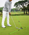 Pro Grade Golf Swing Trainer With Adjustable Angle Tool And Red Fiberglass Direction Rod For Swing Plane Correction Visual Alignment Guide And Muscle Memory Development Green on golf course