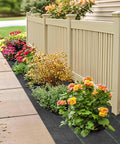 Heavy Duty Weed Barrier Landscape Fabric For Gardens And Lawns, Premium Weed Control, installed along a fence with plants.