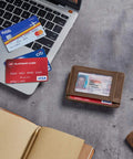 Ultra Slim Wallet For Men With RFID Blocking 13.56 MHz, Front Pocket Money Clip, Minimalist Card Holder, Coffee Color on desk